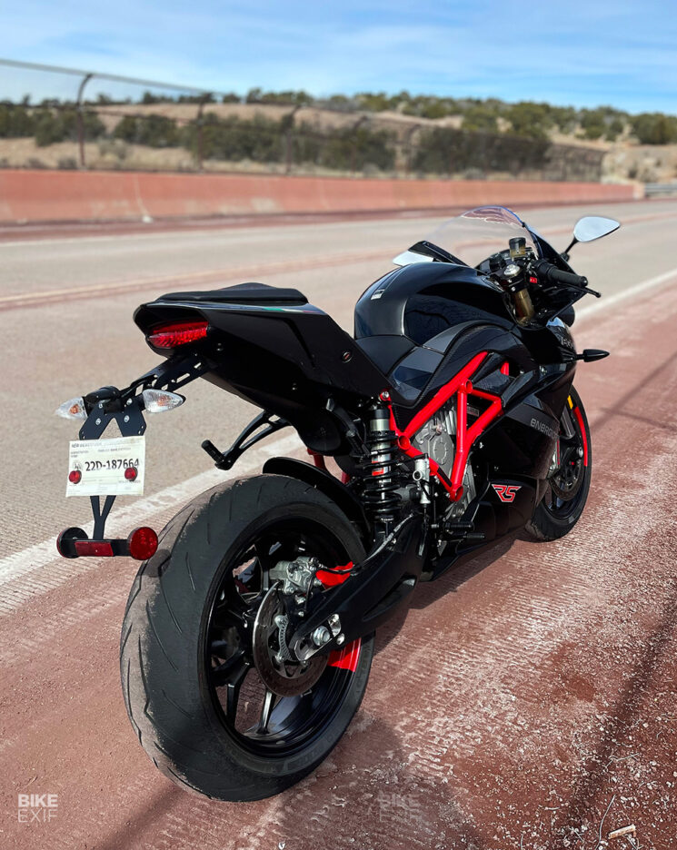 The Energica Ego motorcycle in black on a bridge. 