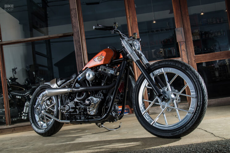 MB Cycles’ 2016 Dyna Low Rider S ‘Cross’ Heidelberg, Germany-based MB Cycles is no stranger to custom Harleys, but this high and mighty Dyna Low Rider S was certainly a diversion from their normal low-slung choppers and bobbers. The impetus for the scrambler-inspired Low Rider, dubbed Cross, came about when a customer came to MB for a custom Harley but didn’t have an exact style in mind. “He used to be a professional dirt bike rider, so I proposed the idea of making something with a bit of off-road character—and enough power to have fun,” says builder Martin Becker. A 110 ci Twin Cam-powered 2016 Dyna fit the bill perfectly, and Martin warmed the engine with a set of Andrews cams, a Screamin’ Eagle air cleaner and a two-into-one exhaust from MCJ with a valve to adjust its volume on the fly. From there, Martin set to work giving the chassis a serious altitude adjustment with the addition of a complete Rebuffini Indianapolis Special front end, and an extended swingarm from Krüger & Junginger with Öhlins remote-reservoir shocks. To add some attitude to the Dyna’s geometry, Martin fabbed up a new rear subframe with a tidy rear loop to support the custom two-up saddle. Two pairs of gnarly pegs from Rebuffini and the moto-style bars from Biltwell reinforce the bike's off-roady aspirations, as do the meaty Bridgestone AX41 knobbies. While Martin indicated that a set of spoked wheels from Kineo would eventually be installed on the Cross, we’d venture to say the Dyna’s stock wheels have never looked better.